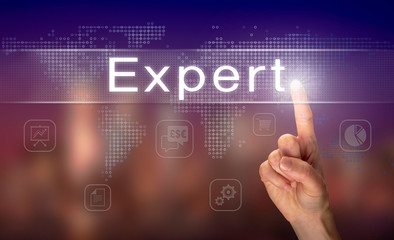 A hand selecting a Expert business concept on a clear screen with a colorful blurred background.