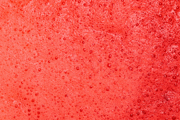 red organic texture of vegetable smoothie