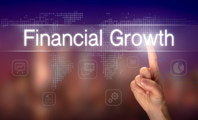 A hand selecting a Financial Growth business concept on a clear screen with a colorful blurred...