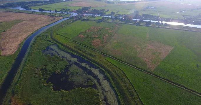 Minge village near the river. Drone camera flaying over the marina on a countryside on a sunny summer day - 008