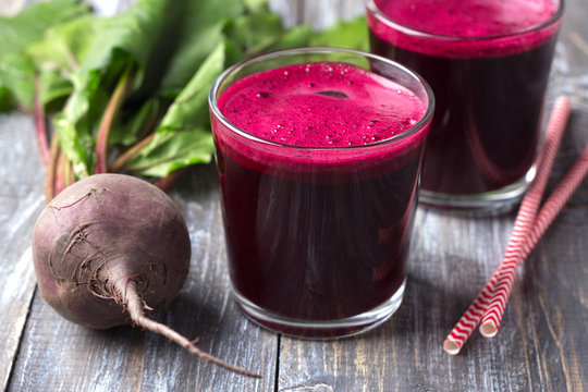 Detox diet. freshly squeezed beet juice in glasses with fresh beets on a wooden table. selective focus