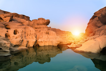 Fototapeta na wymiar Sunrise new day at Sam Phan Bok, as known as the Grand Canyon of Thailand, the biggest rock reef in the Mae Khong River, in Ubon Ratchathani province, Thailand