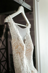 Wedding, white bride dress hanging on the hanger