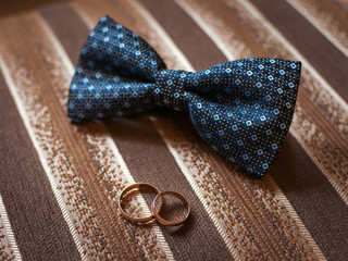 Wedding paraphernalia of the bride and groom on the couch