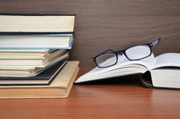 books with reading glasses