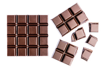 Chocolate cubes, pieces of bitter, dark chocolate bar, isolated on white background, top view