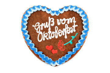Oktoberfest Gingerbread heart with german words greetings from Oktoberfest on white with copy space isolated background.