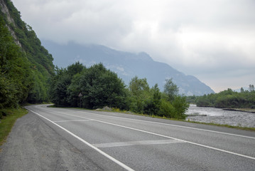 Beautiful landscape with perspective on the asphalt road in the mountains