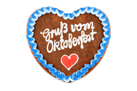 Oktoberfest Gingerbread heart with german words greetings from Oktoberfest on white with copy space isolated background.
