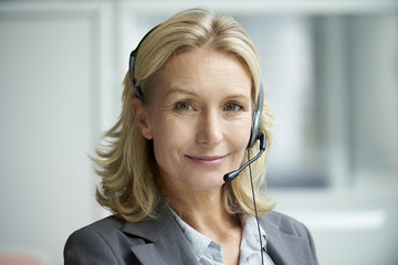 Close-up of telecaller with headset