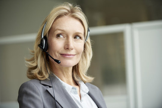 Close-up of telecaller with headset