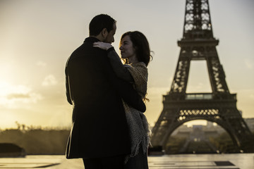Couple embracing at Eiffel Tower