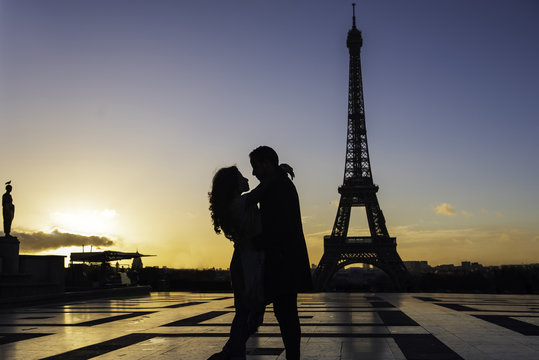 Couple embracing at Eiffel Tower