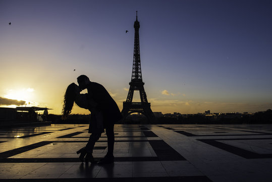 Couple kissing each other at Eiffel Tower