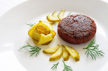 beetroot cutlet with pickled cucumber rose and dill