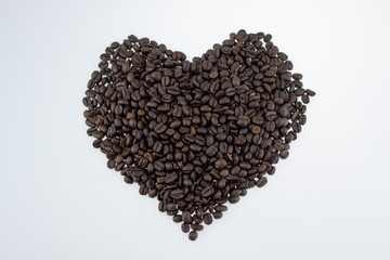 Aromatic coffee beans for espresso coffee to keep the body energized on a white isolate background,