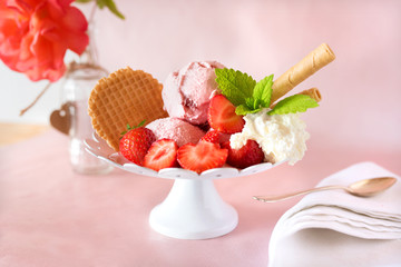 Ice cream with strawberries and whipped cream