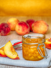 Jar of homemade peach jam
