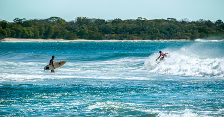 surfer on blue ocean