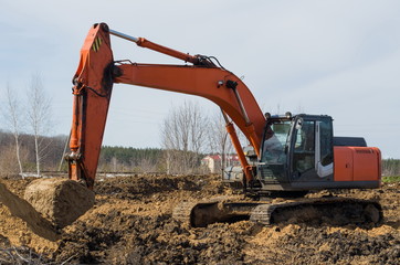 crawler excavator on cleared land, closeup