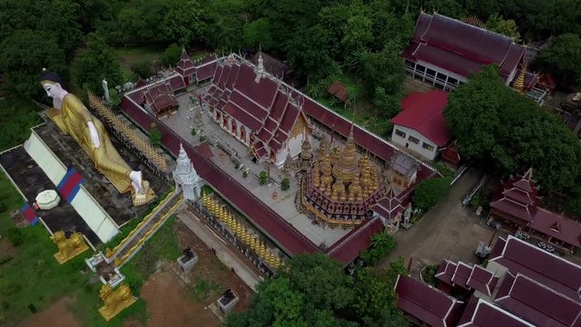 Aerial View of Buddhist Temple Wat Phra That Suthon Mongkon Khiri features beautiful architectures that are inspired by the ancient, traditional ordination hall (Ubosot) and reclining Buddha statue