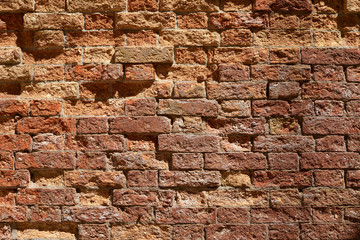 Old broken brick wall texture background, sunlight