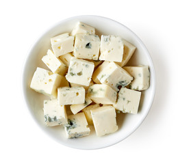 Bowl of blue cheese isolated on white, from above
