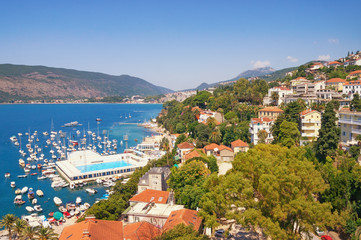 Fototapeta na wymiar Mediterranean landscape. Montenegro, Bay of Kotor, Adriatic Sea. Beautiful summer view of coastal town of Herceg Novi