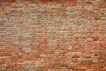 Old brick wall texture background in a sunny day, high detail