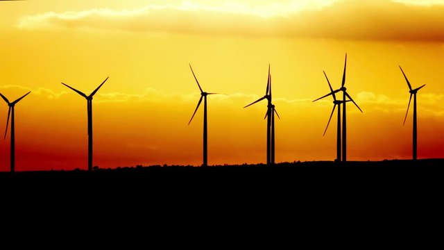 Wind turbine power generator at twilight. Cyprus