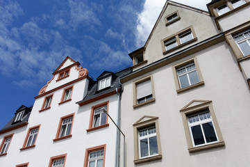 Street photography. Historic, classicist buildings in Germany. Blue sky with clouds.