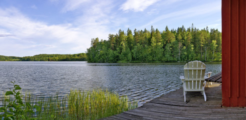 Garden chair beside a lake © leopold