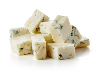 Blue cheese cubes isolated on white