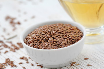 Linen seeds and linseed oil in glass