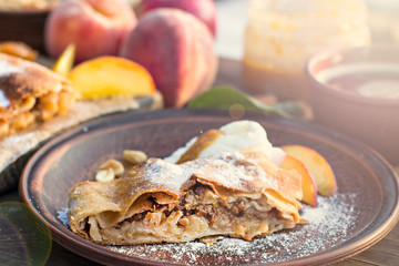 strudel with peaches, apples and peanuts
