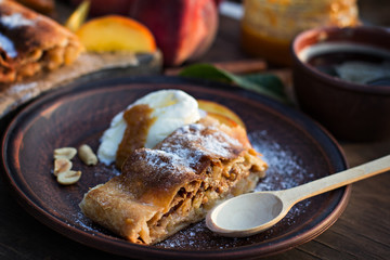 strudel with peaches, apples and peanuts