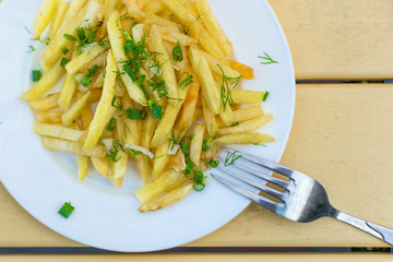 French fries on a plate in a cafe.