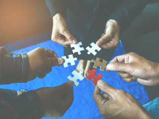 business people holding jigsaw puzzle and represent team support ,team work concept