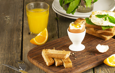 Scrambled eggs with herbs on wheat-rye crispy bread, homemade