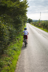 Young cyclist on a country road