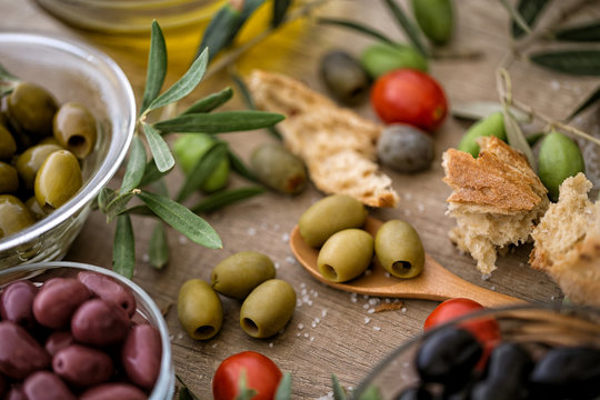 Mix of assorted whole Greek olives for snack.