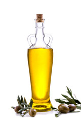 Olive oil bottle with fresh leaves and olives isolated on white.