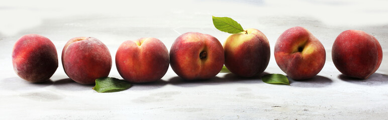 A group of ripe peaches on table