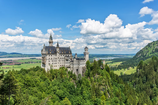 Hohenschwangau, Germany - June 10, 2018: The idyllic Neuschwanstein Castle positioned high up on a mountain in the Bavarian Alps. Commissioned by King Ludwig II of Bavaria.