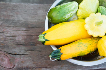 zucchini and cucumber on a wooden background