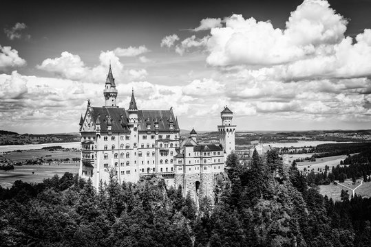 Hohenschwangau, Germany - June 10, 2018: The idyllic Neuschwanstein Castle positioned high up on a mountain in the Bavarian Alps. Commissioned by King Ludwig II of Bavaria.