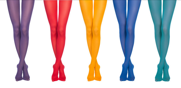 Women's legs in colorful tights isolated.