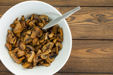 Overhead view of savory mushroom dish with spoon