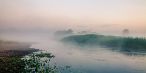 Biebrza Natural Park - foggy sunrise over Biebrza river. 
