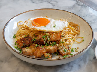 Sizzling hot and creamy Spaghetti Crispy pork Carbonara topped with Onsen Egg